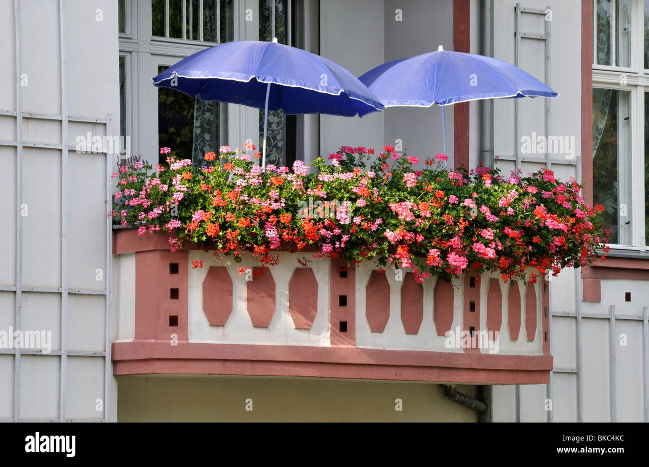 Balcony with geraniums Stock Photo - Alamy