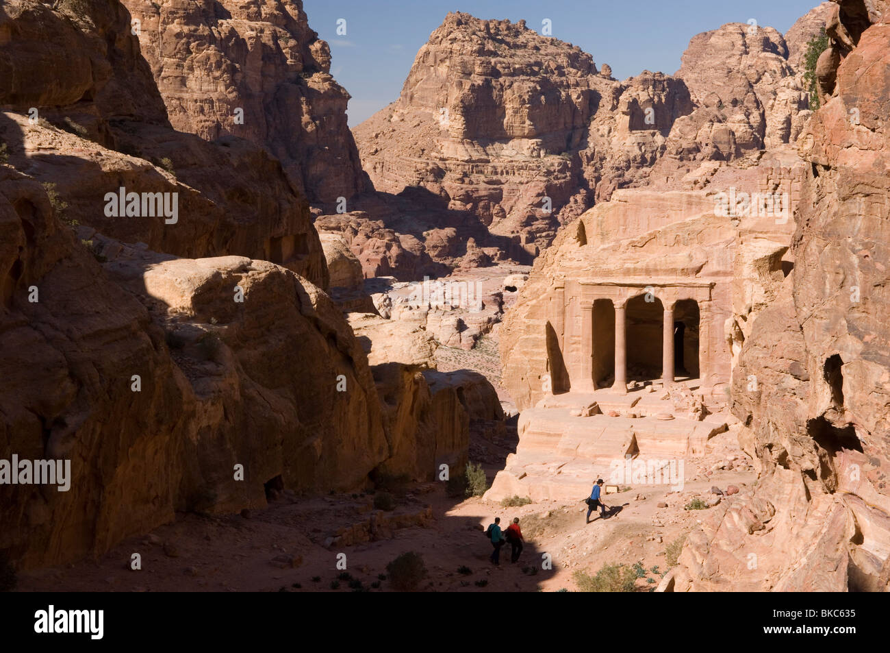Tourists investigating the Garden Tomb in Petra, Jordan Stock Photo