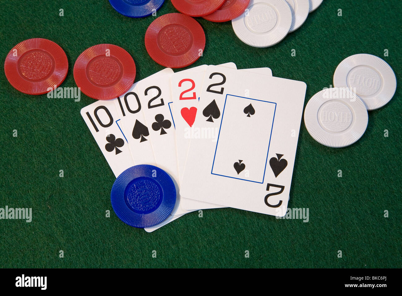 A 'full house' poker hand, treys and tens, a good poker hand in five card draw or stud poker deck of cards poker game Stock Photo