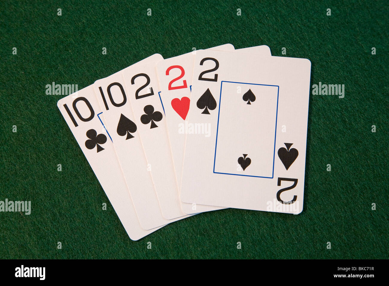 A 'full house' poker hand, deuces and tens, in five card draw or stud poker Stock Photo