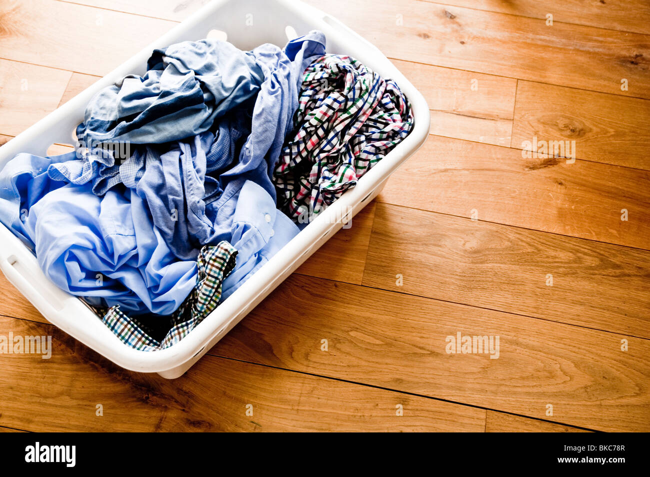 Washing in a basket, clean, wet and  ready to be hung out to dry Stock Photo