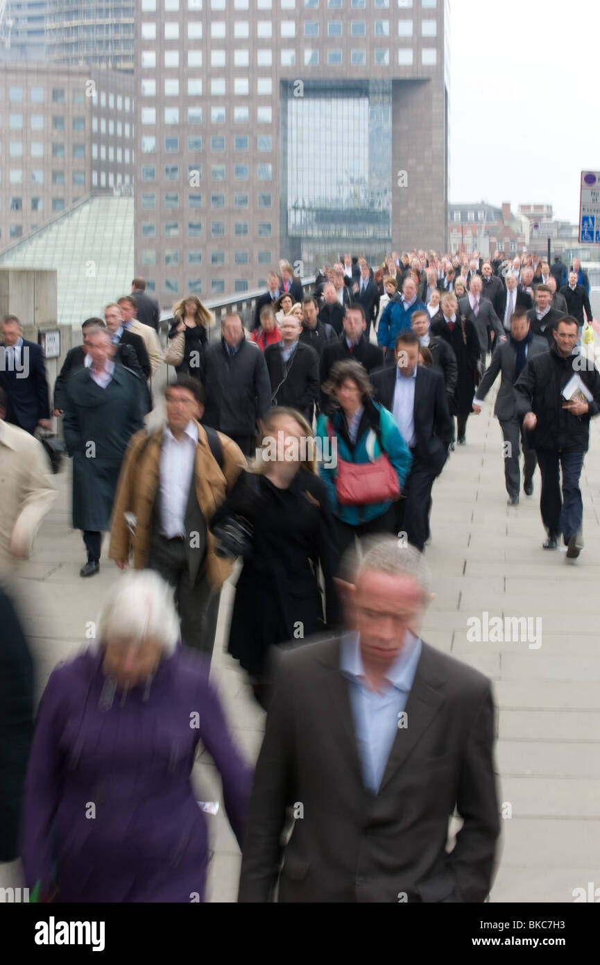 Commuters surging across London Bridge in the morning rush hour, 8am, April 2010, UK Stock Photo