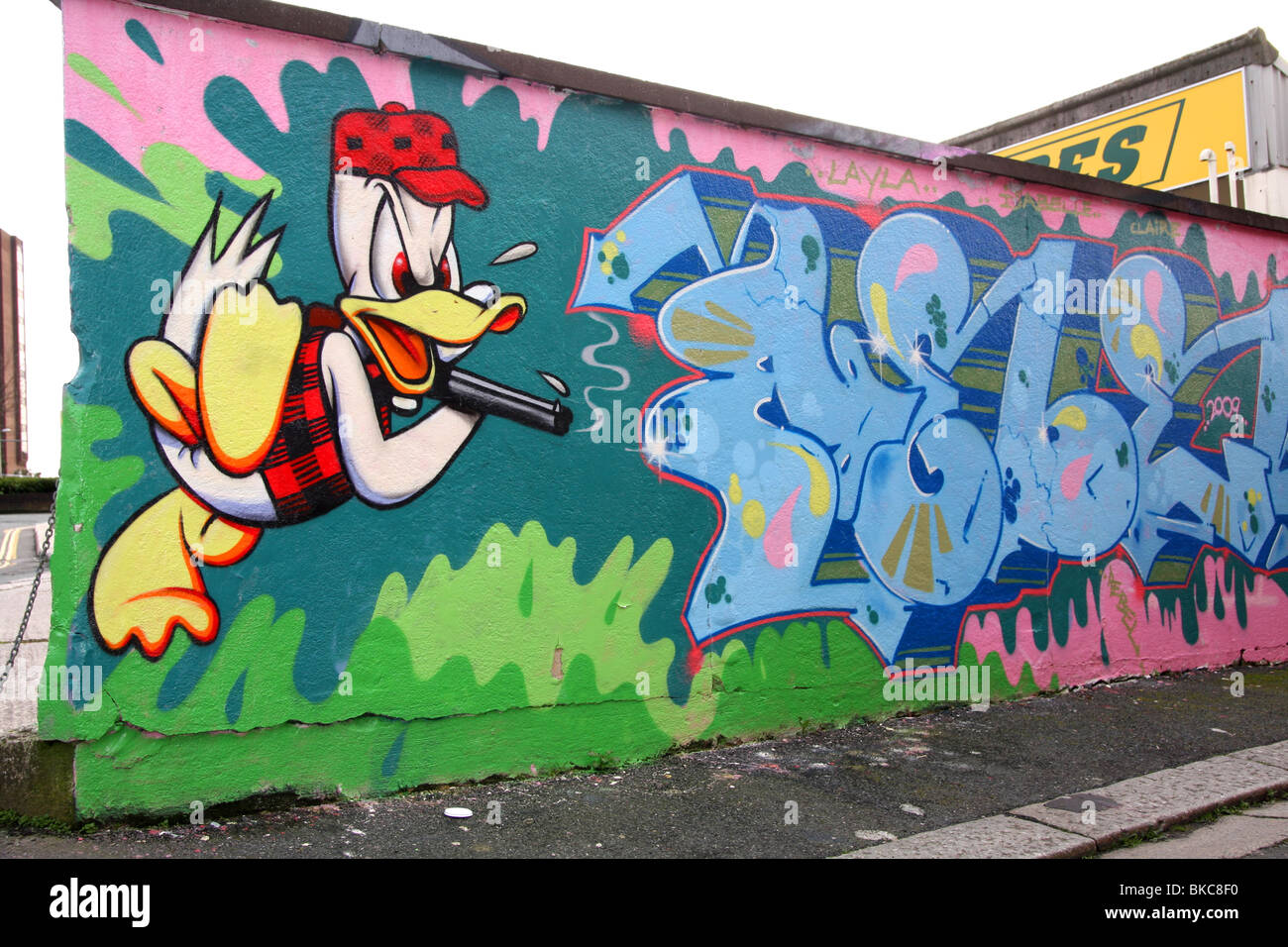 Donald Duck is an American cartoon character The Walt Disney Company as seen in the graffiti character painted on this wall-side Stock Photo