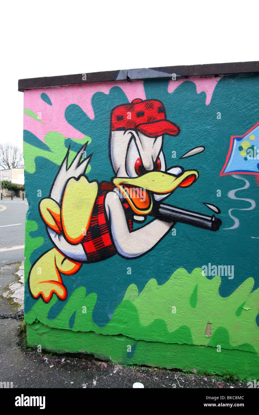 Donald Duck is an American cartoon character The Walt Disney Company as seen in the graffiti character painted on this wall-side Stock Photo