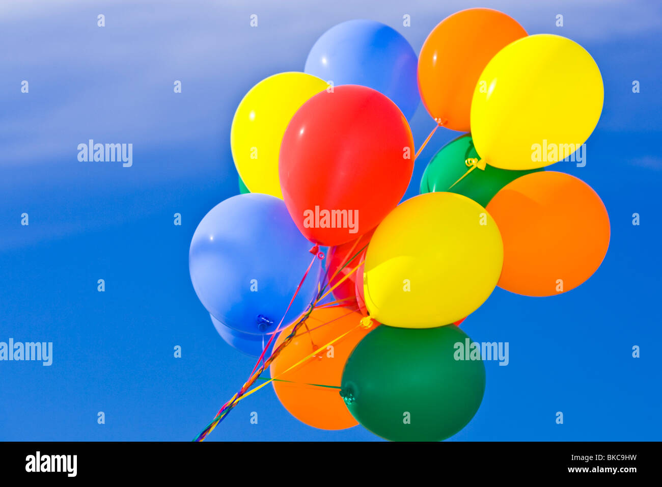 Colorful balloons against a blue sky Stock Photo