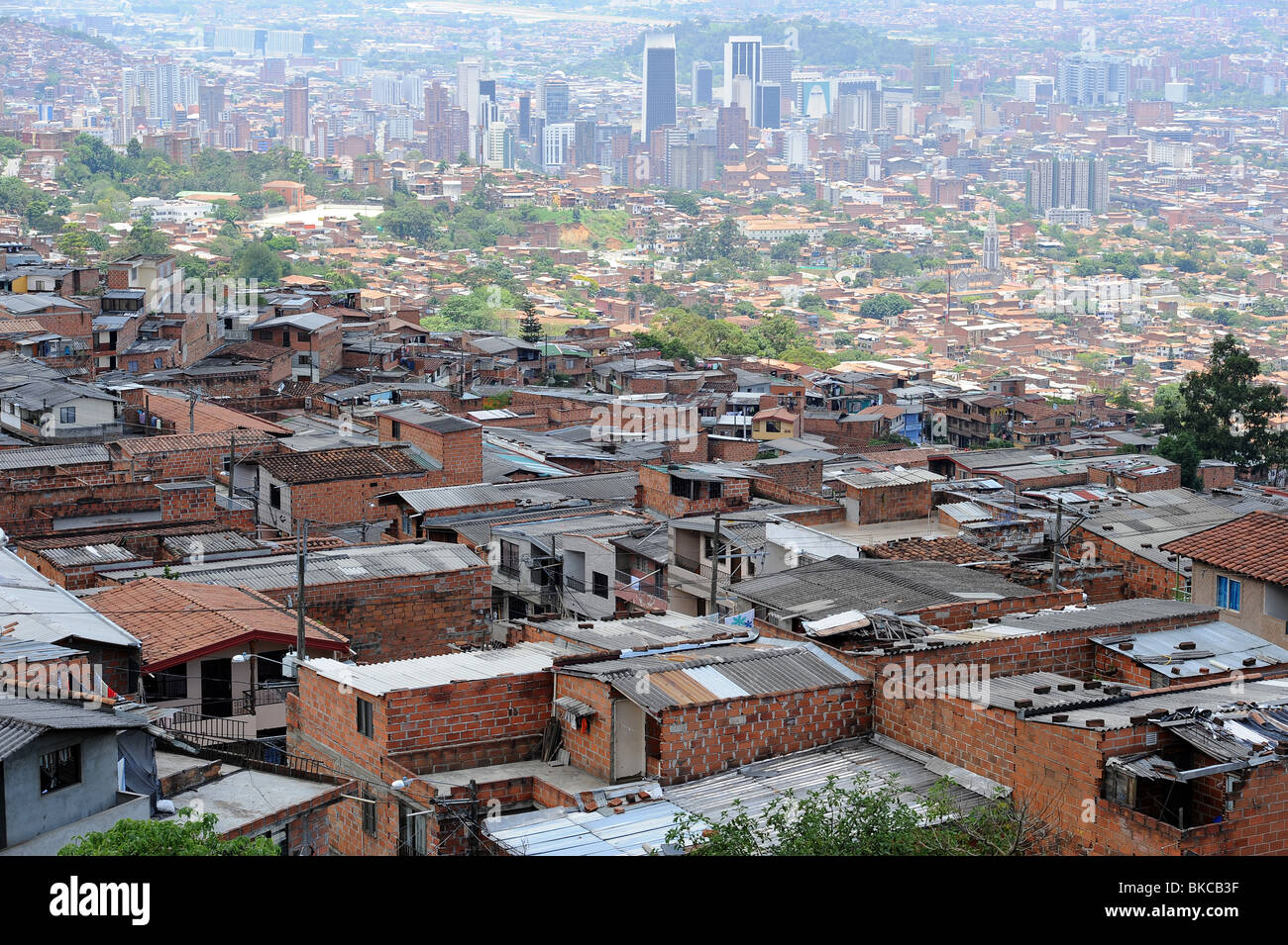 View of densely populated mountain villages overlooking skyscrapers and