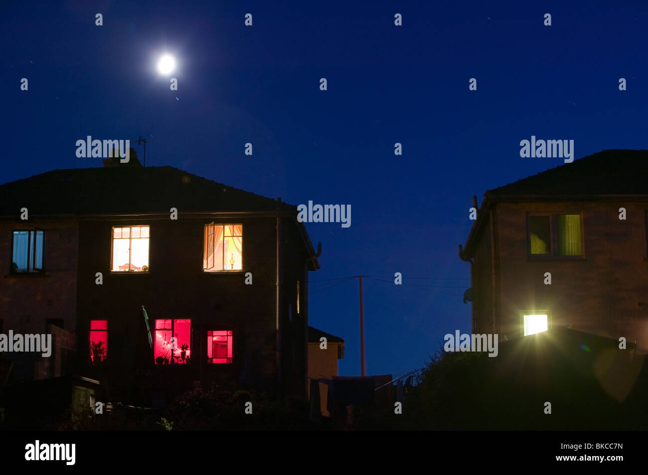A moon and house at night Ambleside UK Stock Photo