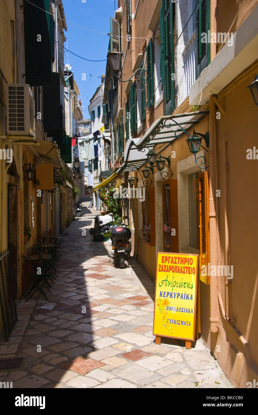Corfu old Town. Narrow street with shops between buildings in old Corfu