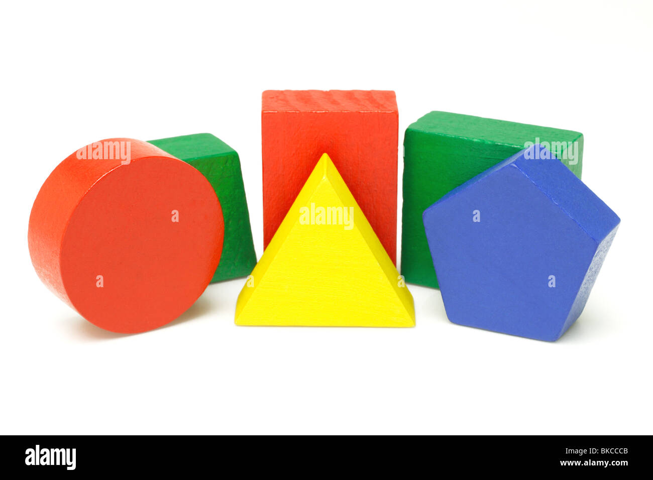 Colorful wooden geometric blocks on white background Stock Photo