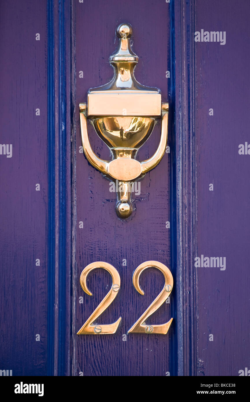 No 22 dark blue front door of house with brass knocker Ludlow Shropshire England UK Stock Photo