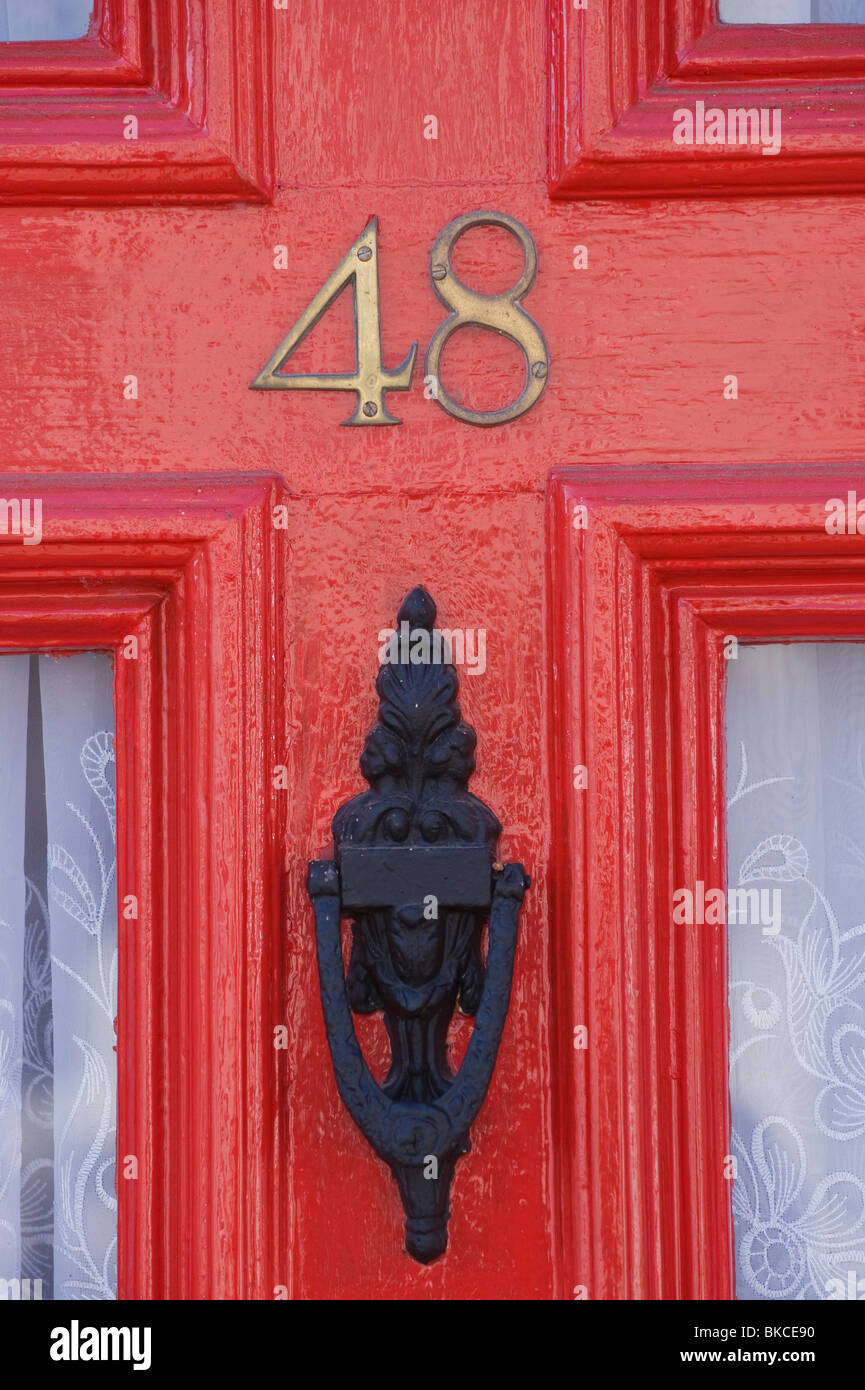 No 48 red front door of house with knocker Ludlow Shropshire England UK Stock Photo