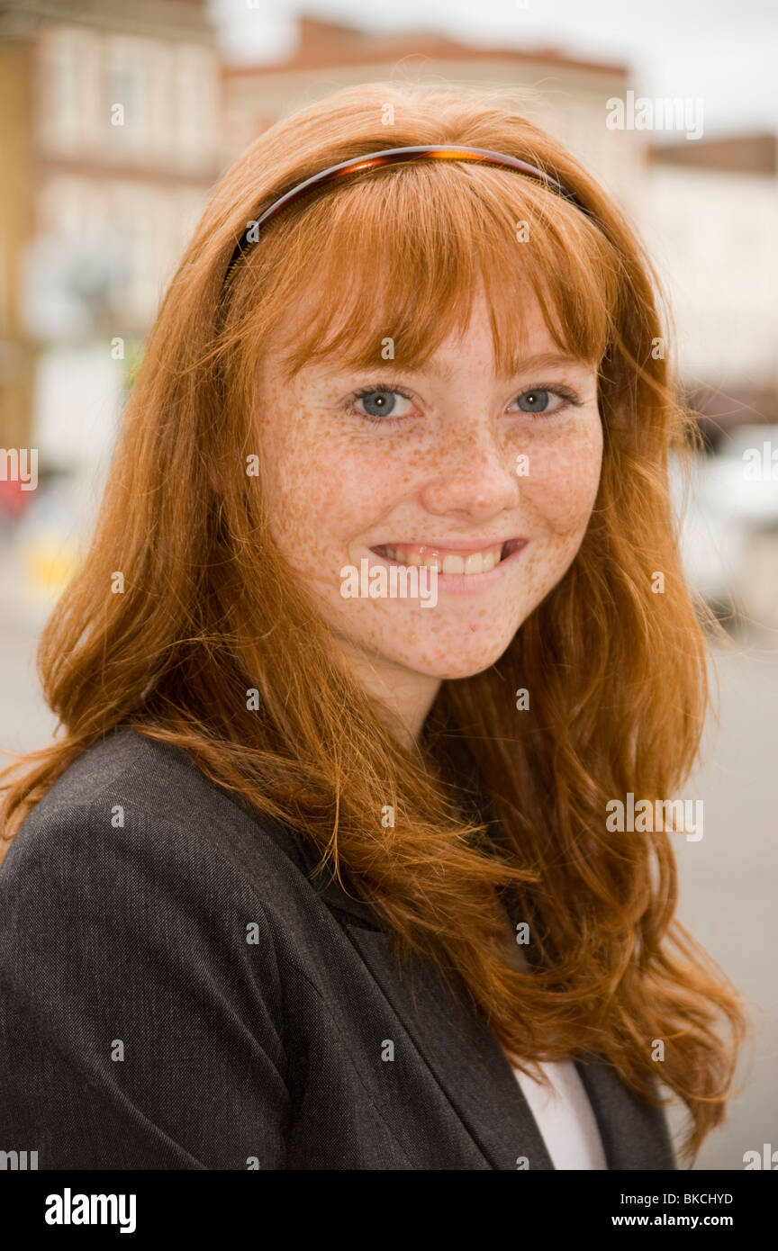 portrait of a teenage girl with red hair blue eyes and lots of freckles Stock Photo