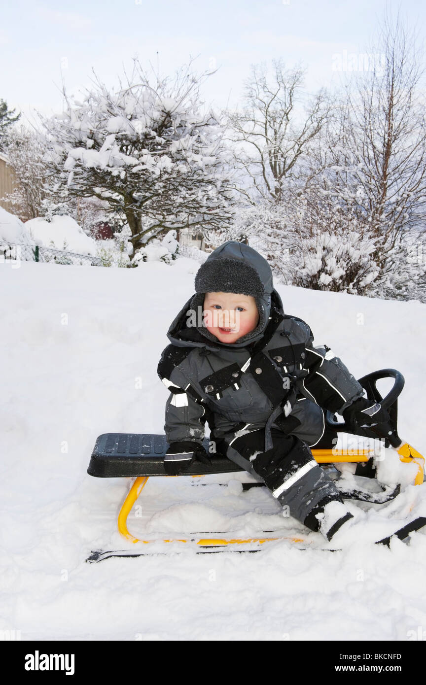 Baby playing in snow Stock Photo Alamy
