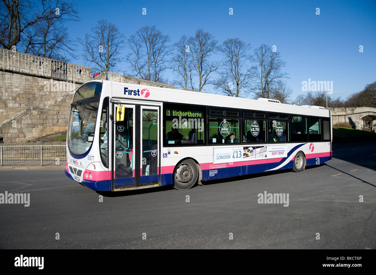 Single decker bus in First livery in York. Stock Photo