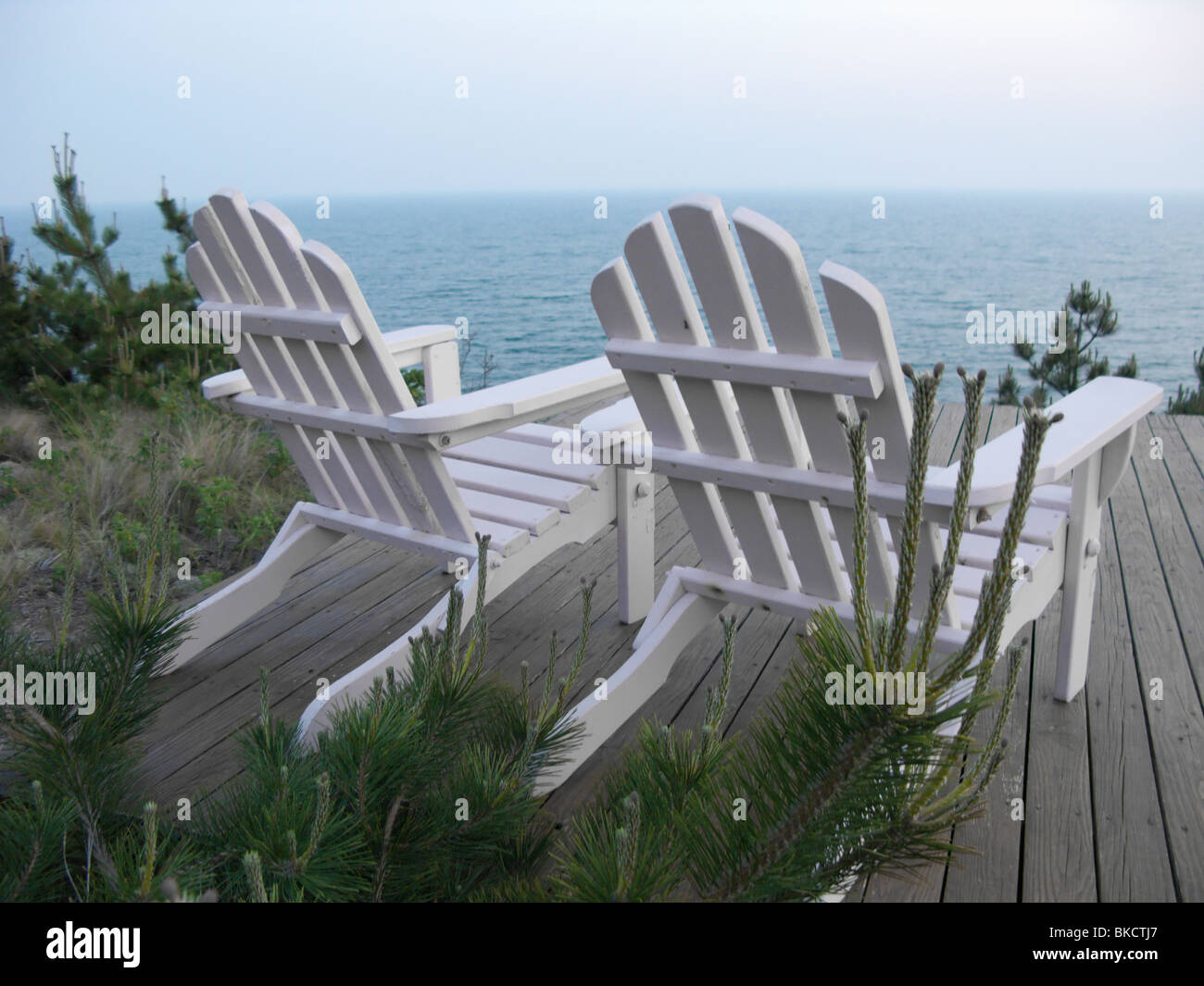 Two Adirondack Chairs on deck Ocean View Stock Photo Alamy