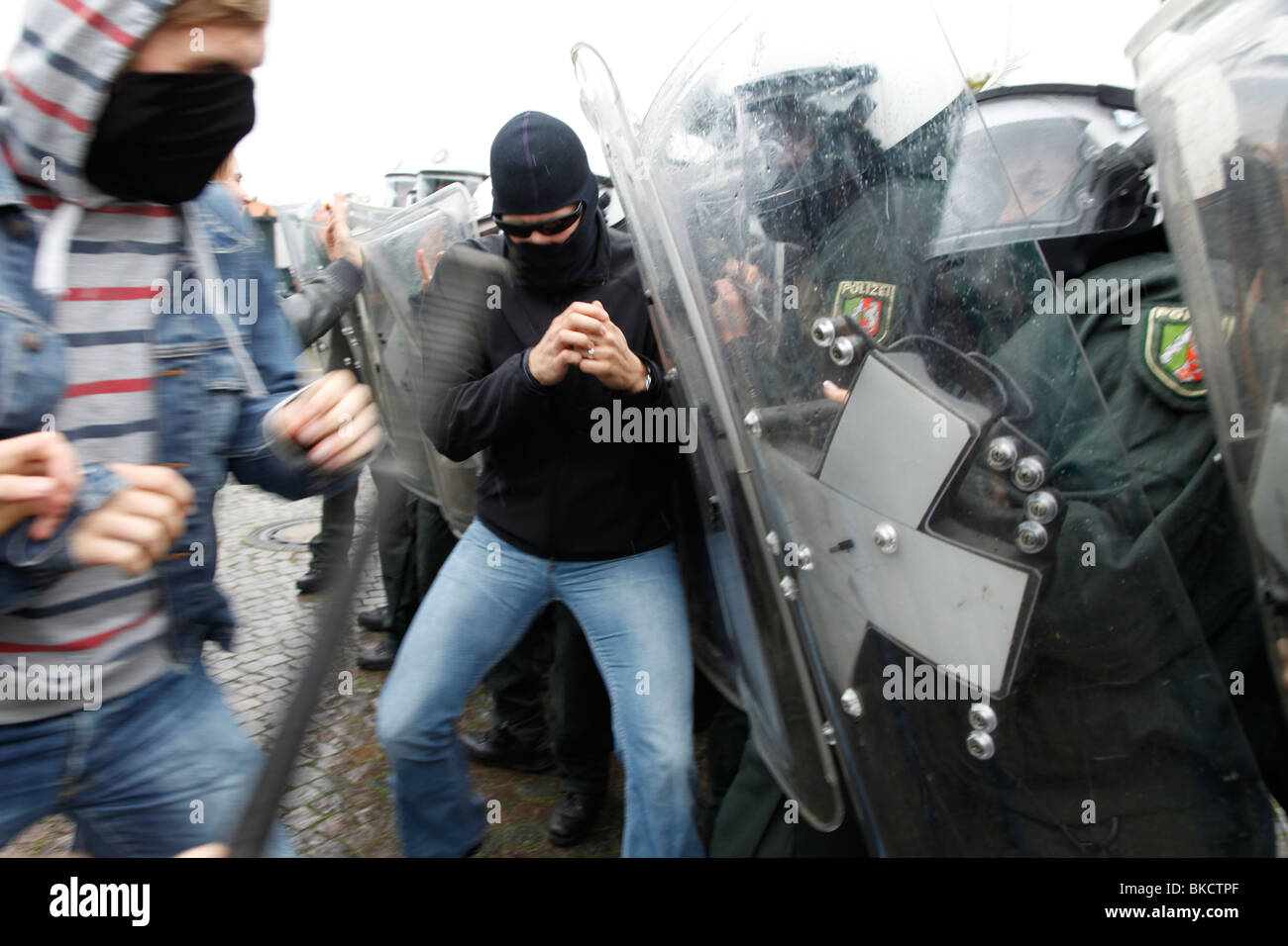 Violence against police officers. Exercise of an anti riot police unit. Violent demonstrators attacks police forces. Stock Photo