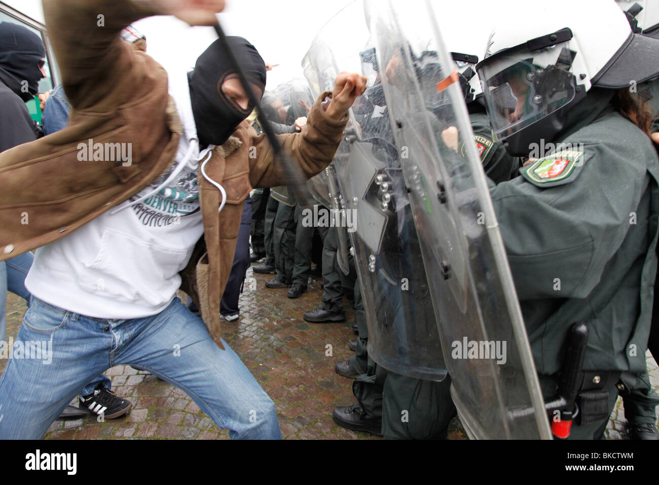 Violence against police officers. Exercise of an anti riot police unit. Violent demonstrators attacks police forces. Stock Photo
