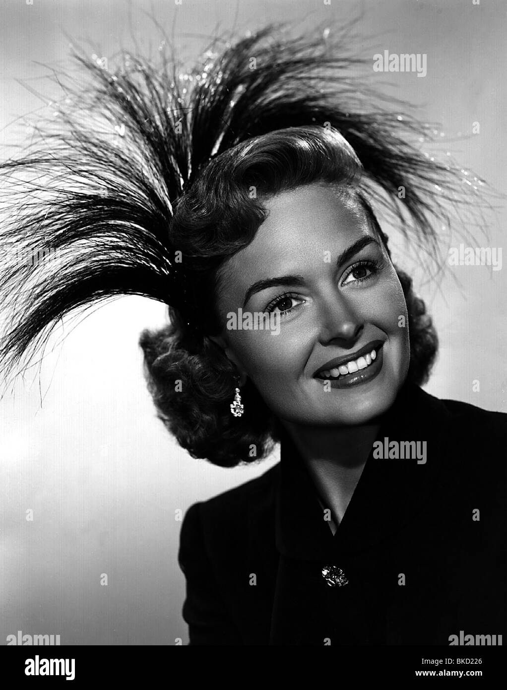 fashion, 1950s, ladies' fashion, hats, woman wearing feather headdress, Stock Photo