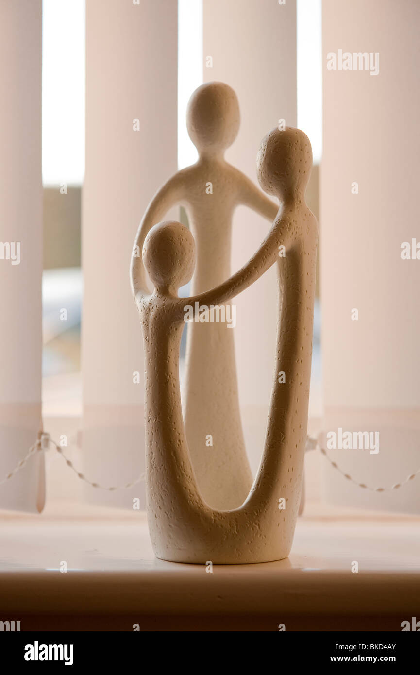 Modern statue ornament of family holding hands Stock Photo Alamy