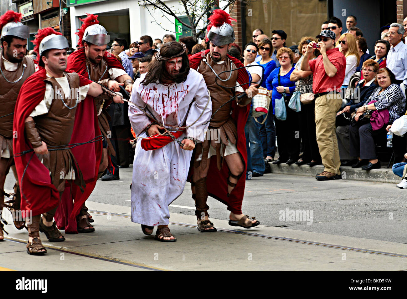 Jesus walks with cross at Holy Easter or Good Friday Procession Parade,' Little Italy', Toronto,Ontario,Canada,North America Stock Photo