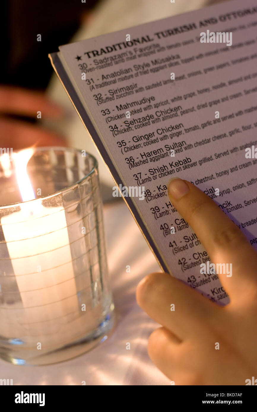 Person reading a menu at a restaurant in Istanbul, Turkey Stock Photo