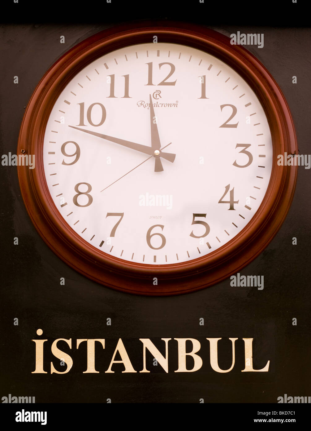 A clock displays the local time in Istanbul, Turkey. Stock Photo