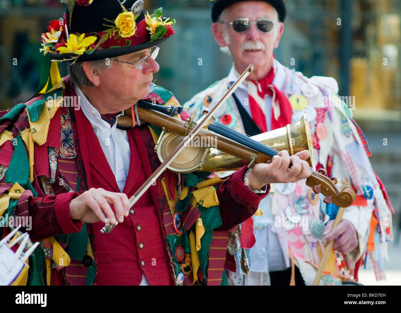 Morris musician playing the Stroh violin, (aka phonofiddle or violinophone) at the Oxford Folk Festival. Stock Photo