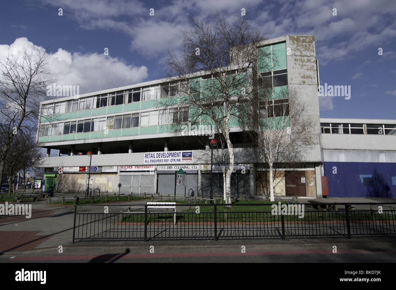 Typical ugly eyesore 1960s office and shop block, Victoria House in North Cheam, Sutton, London England Stock Photo