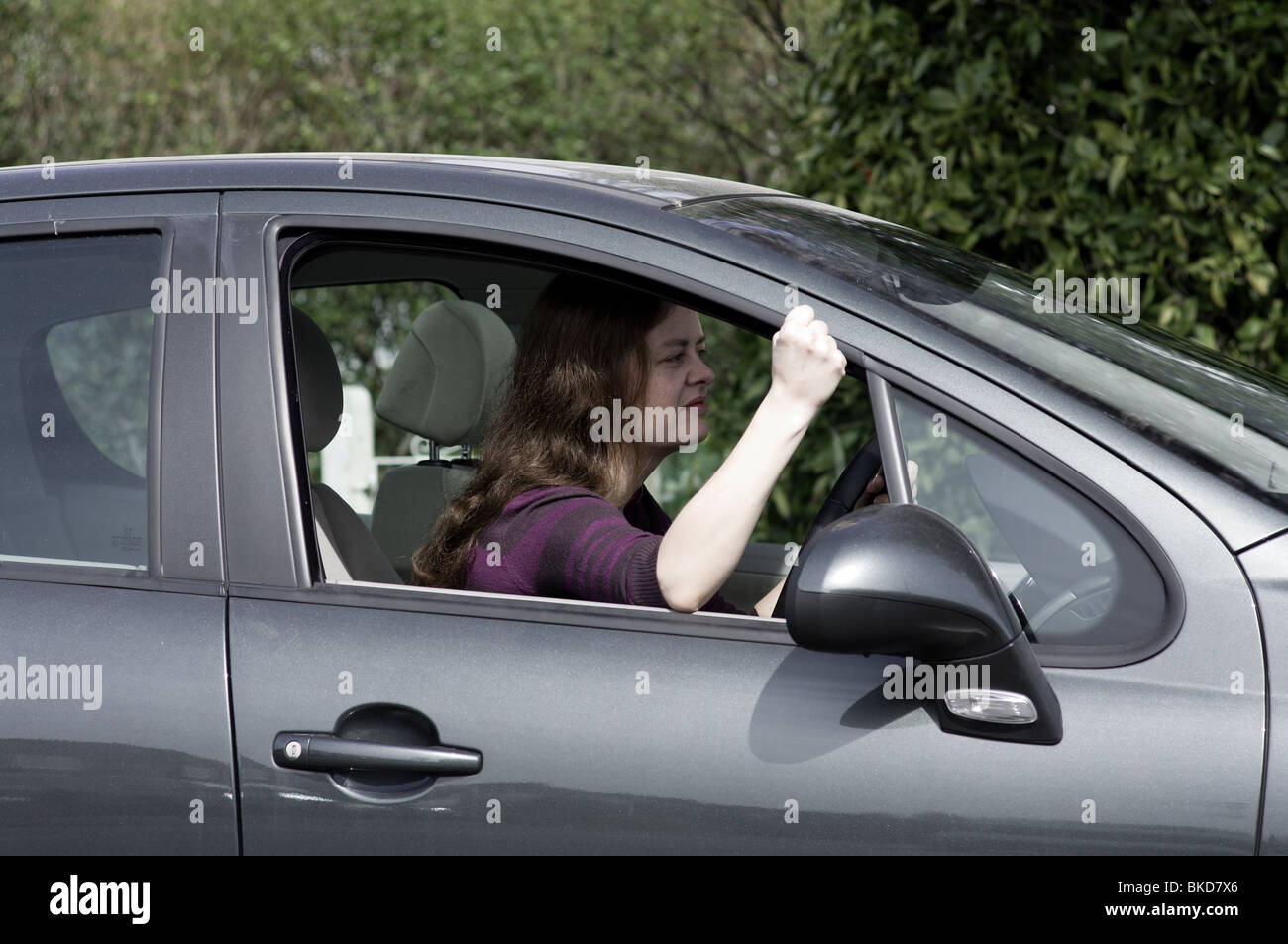 Young woman in car frustrated and tense Stock Photo