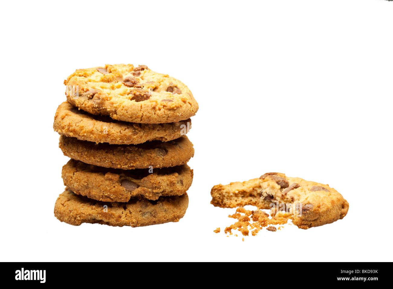 Stack of chocolate chip cookies on white cut out with one half eaten Stock Photo