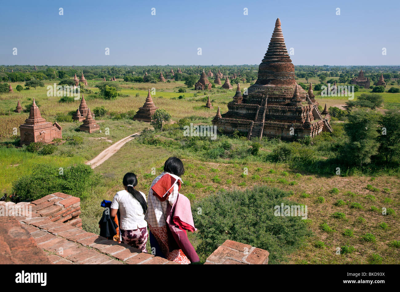 Burmese women at the top of a temple. Buledi group temples. Bagan. Myanmar Stock Photo