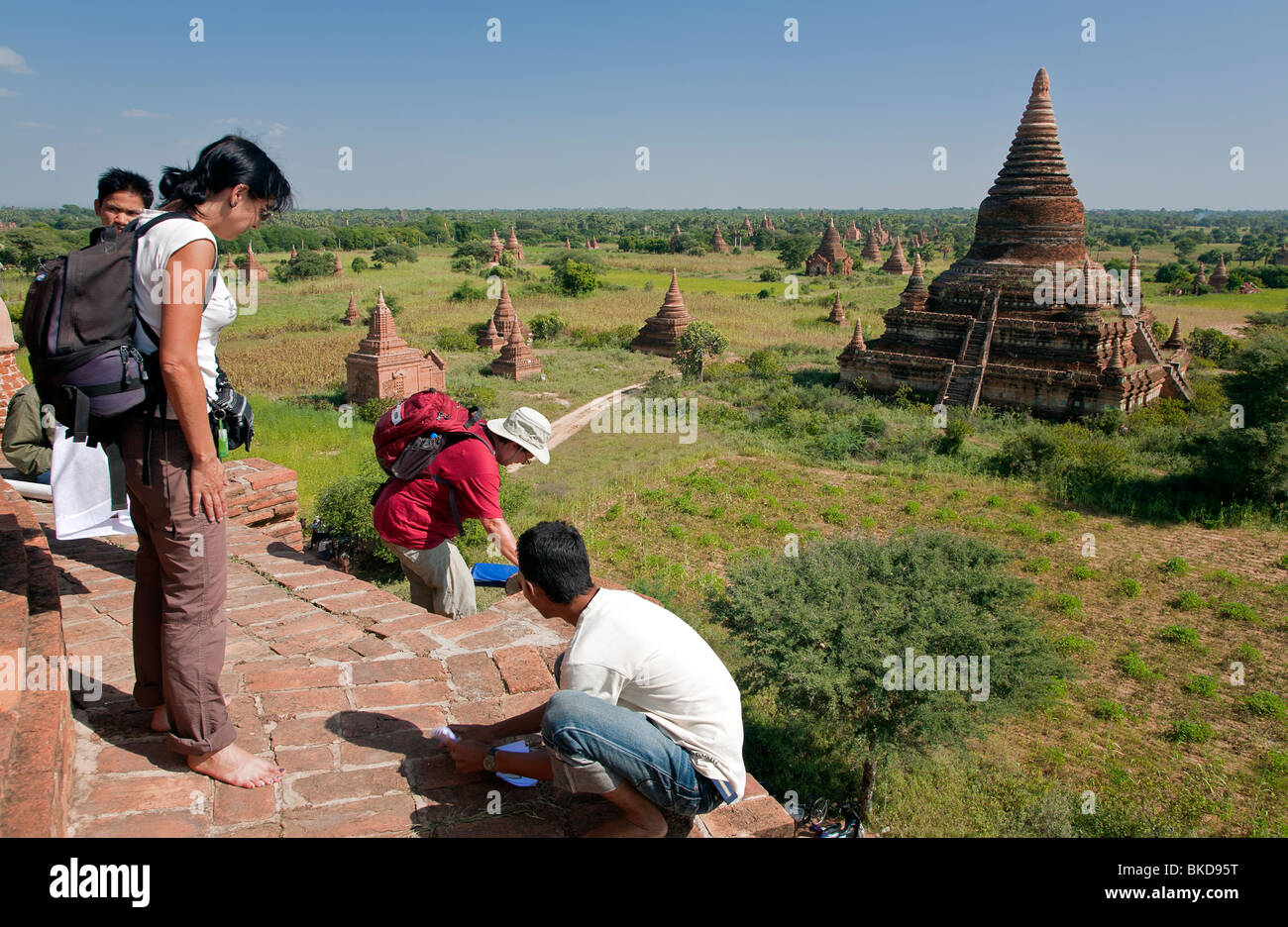 Tourists at the top of a temple. Buledi temple group. Bagan. Myanmar Stock Photo
