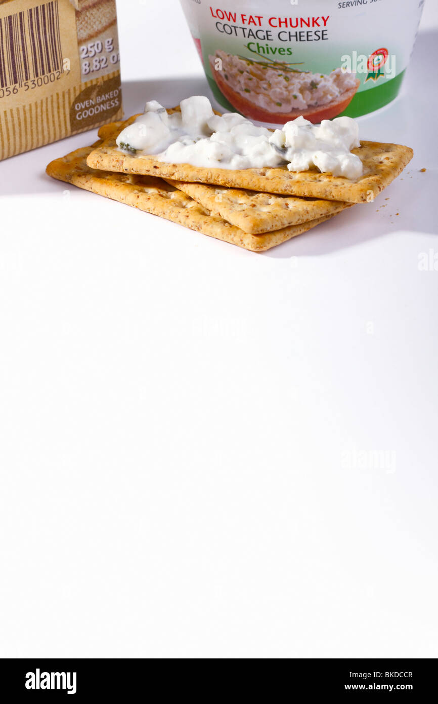 High fibre crackers and low fat cottage cheese. Stock Photo