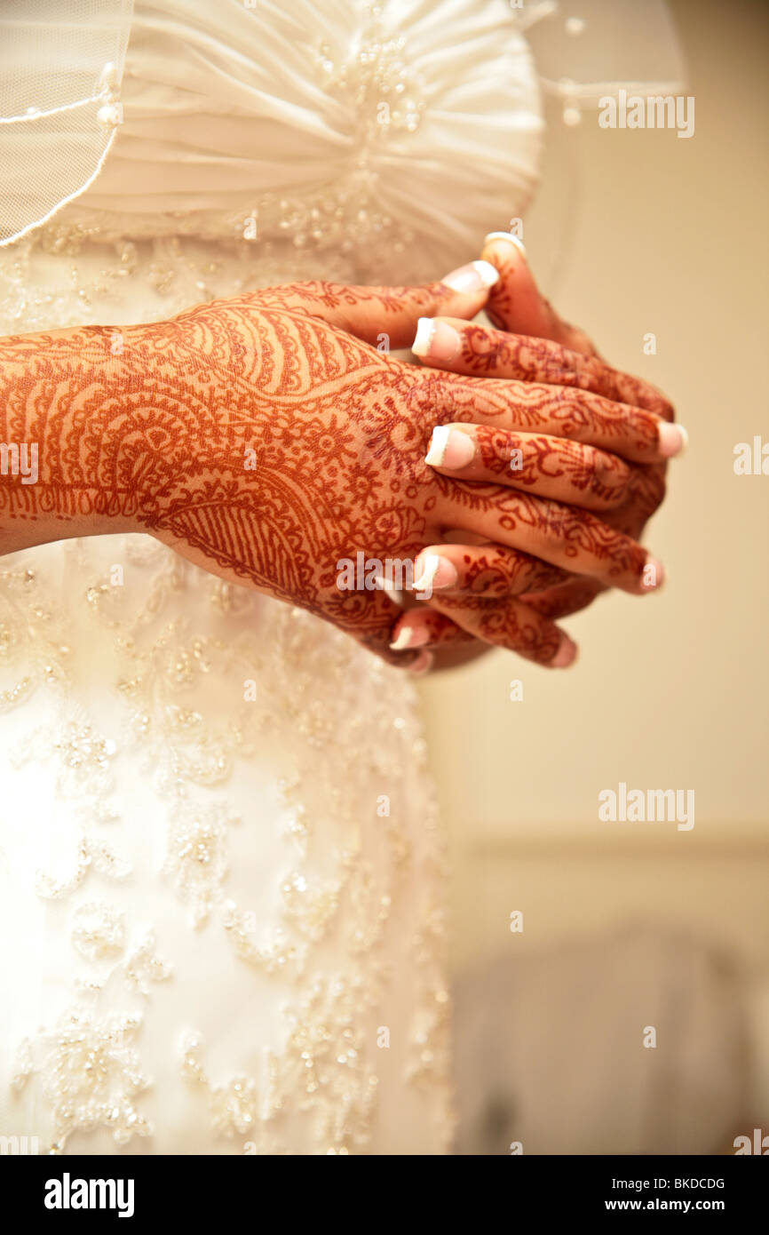 Bride with henna painted hands. Stock Photo