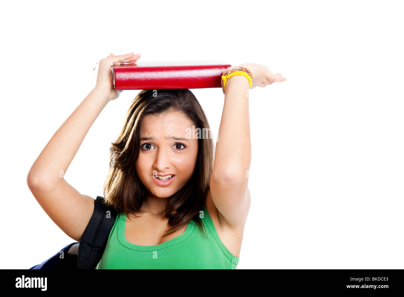 Beautiful young female student worried before an exam, isolated on white Stock Photo