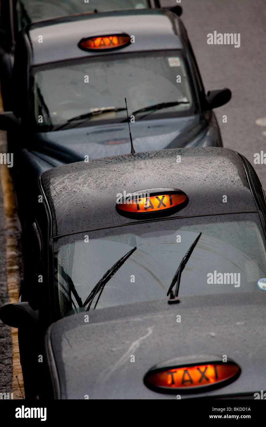 London Taxi Queue or London Taxi Rank - London Black Cabs waiting for hire. Stock Photo