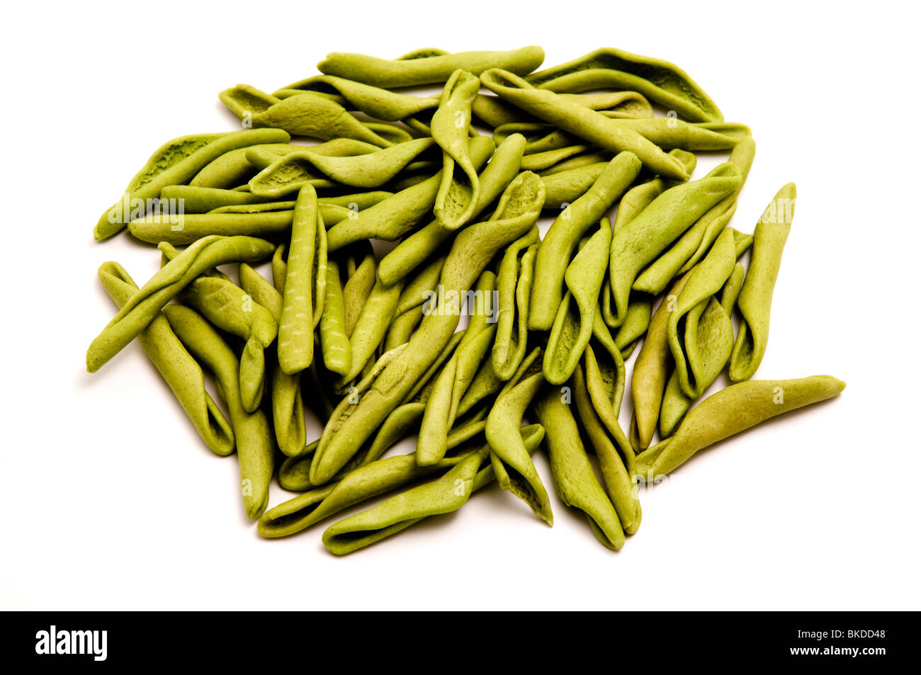 Green homemade fusilli on a white background Stock Photo