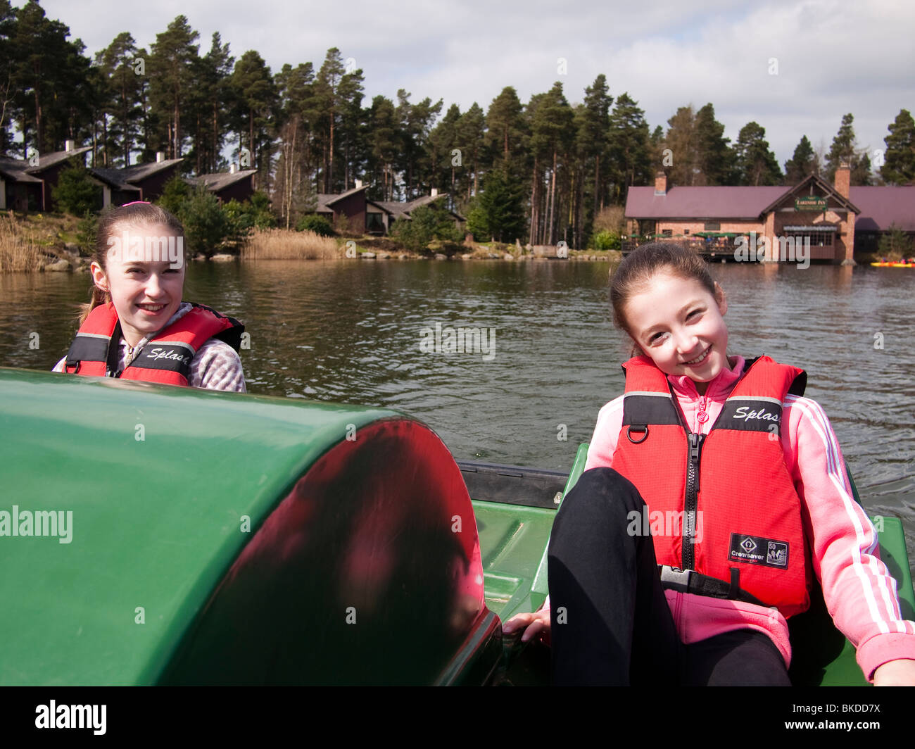 Two Young Girls on a Pedalo, Centre Parcs Stock Photo