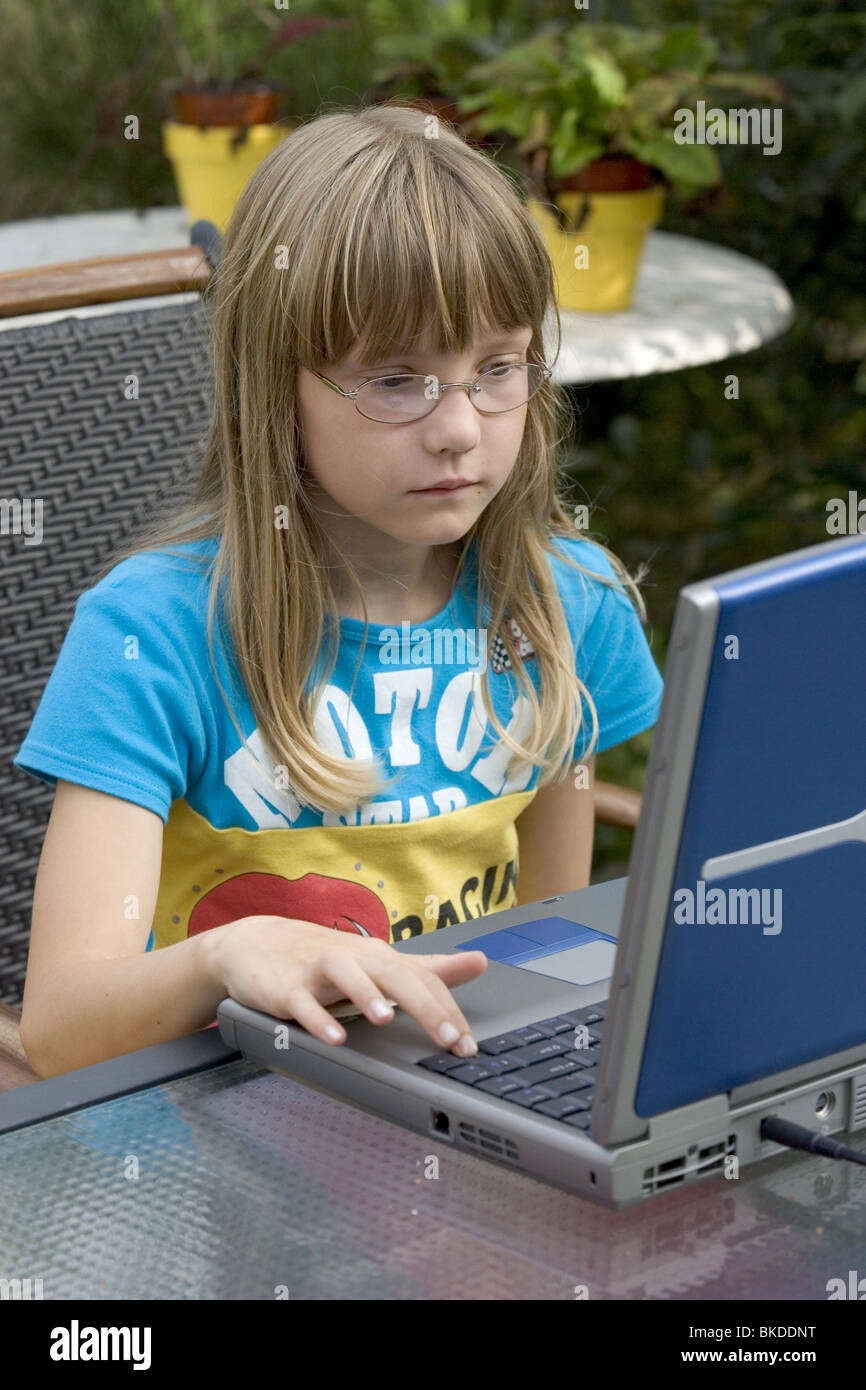 child learning from laptop computer outside Stock Photo - Alamy