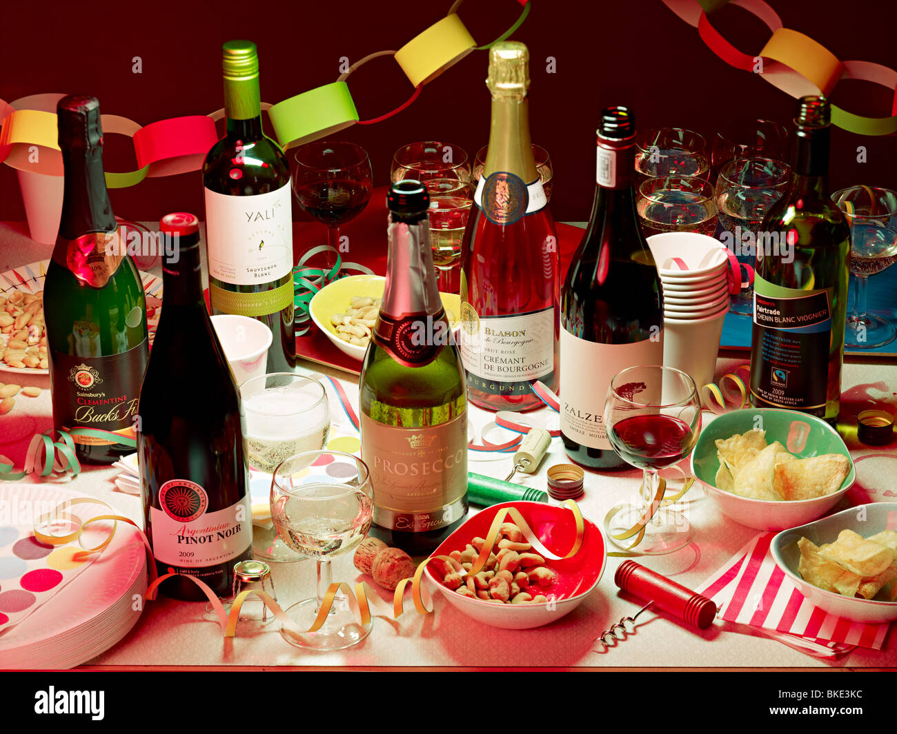 drinks party selection booze on table coloured lighting Stock Photo