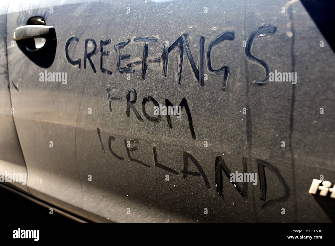 Message written in dust on a car caused by the volcanic ash from the eruption in Iceland April 2010 UK Stock Photo