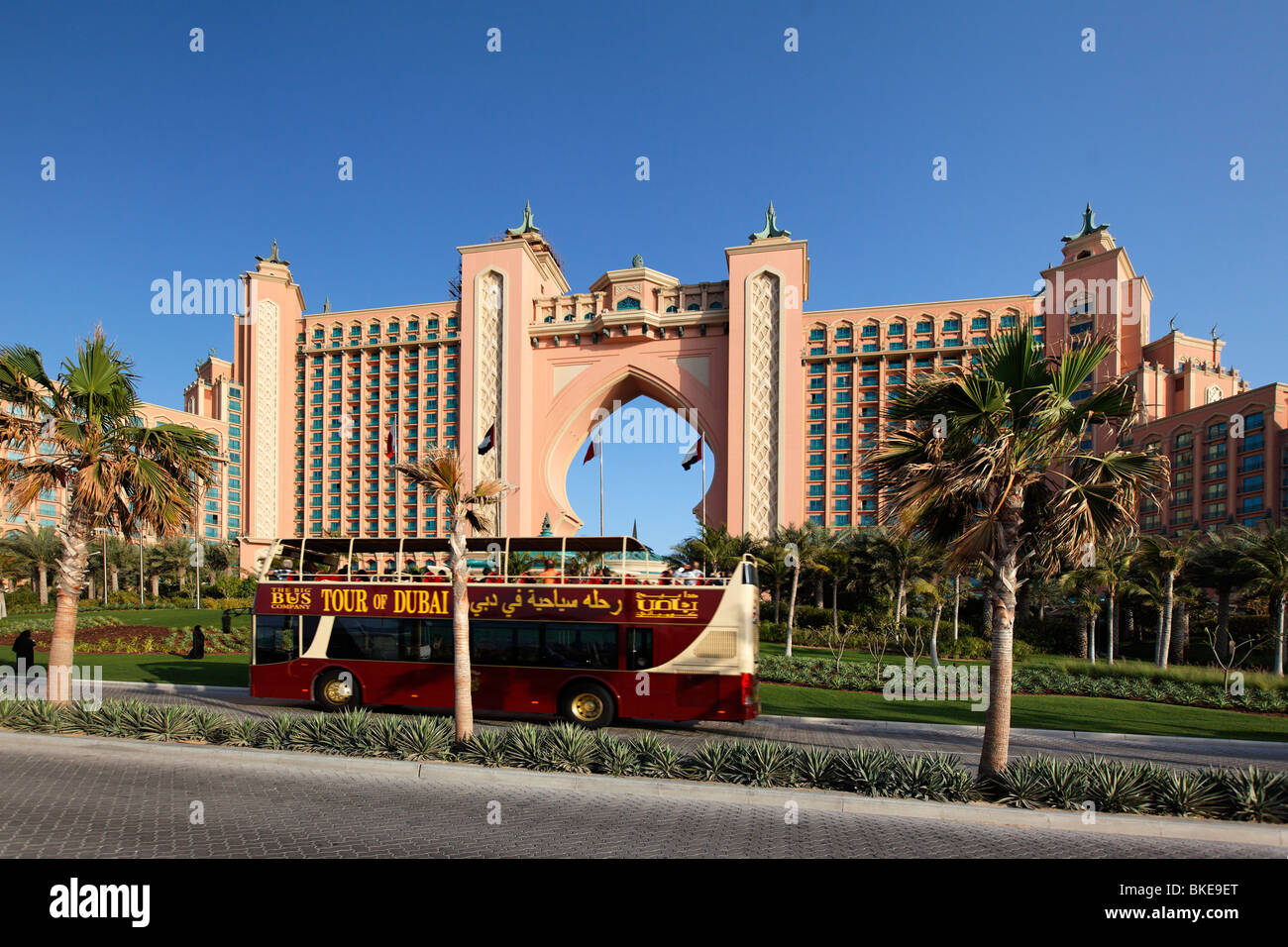 Tour Bus in front of Atlantis Hotel, The Palm Jumeirah, Dubai , UAE Stock Photo