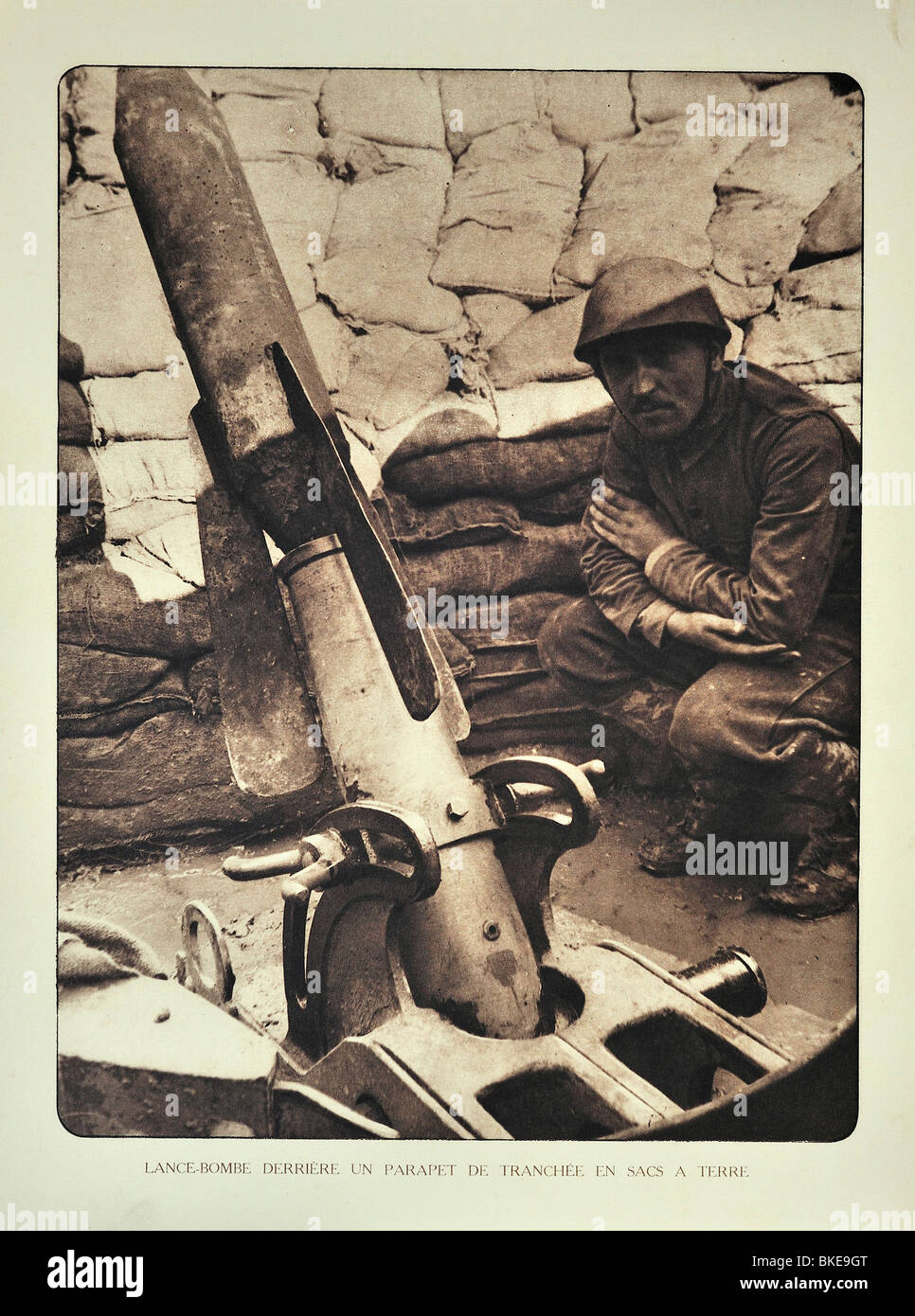 Belgian WWI soldier / gunner and trench mortar loaded with bomb in West Flanders during the First World War One, Belgium Stock Photo