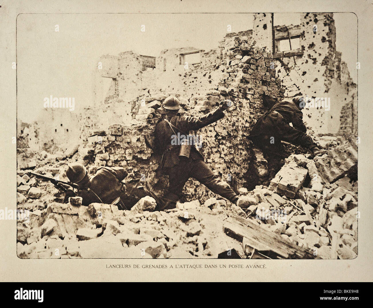 WW1 Belgian soldiers in ruined house throwing hand grenades at Germans in West Flanders during the First World War One, Belgium Stock Photo