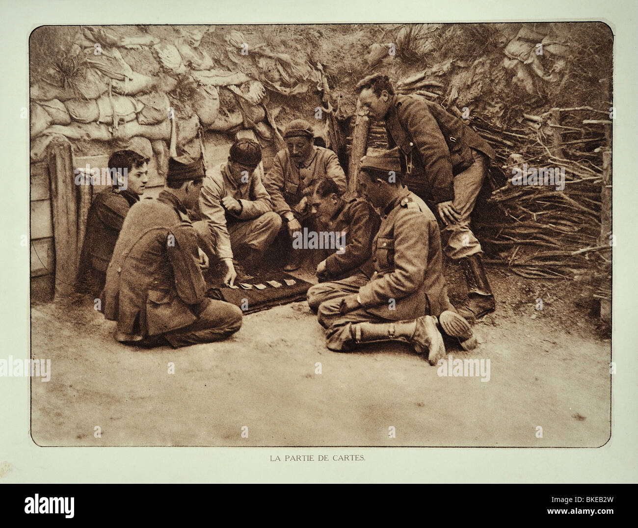 WW1 Belgian soldiers at rest playing cards in trench in West Flanders during the First World War One, Belgium Stock Photo