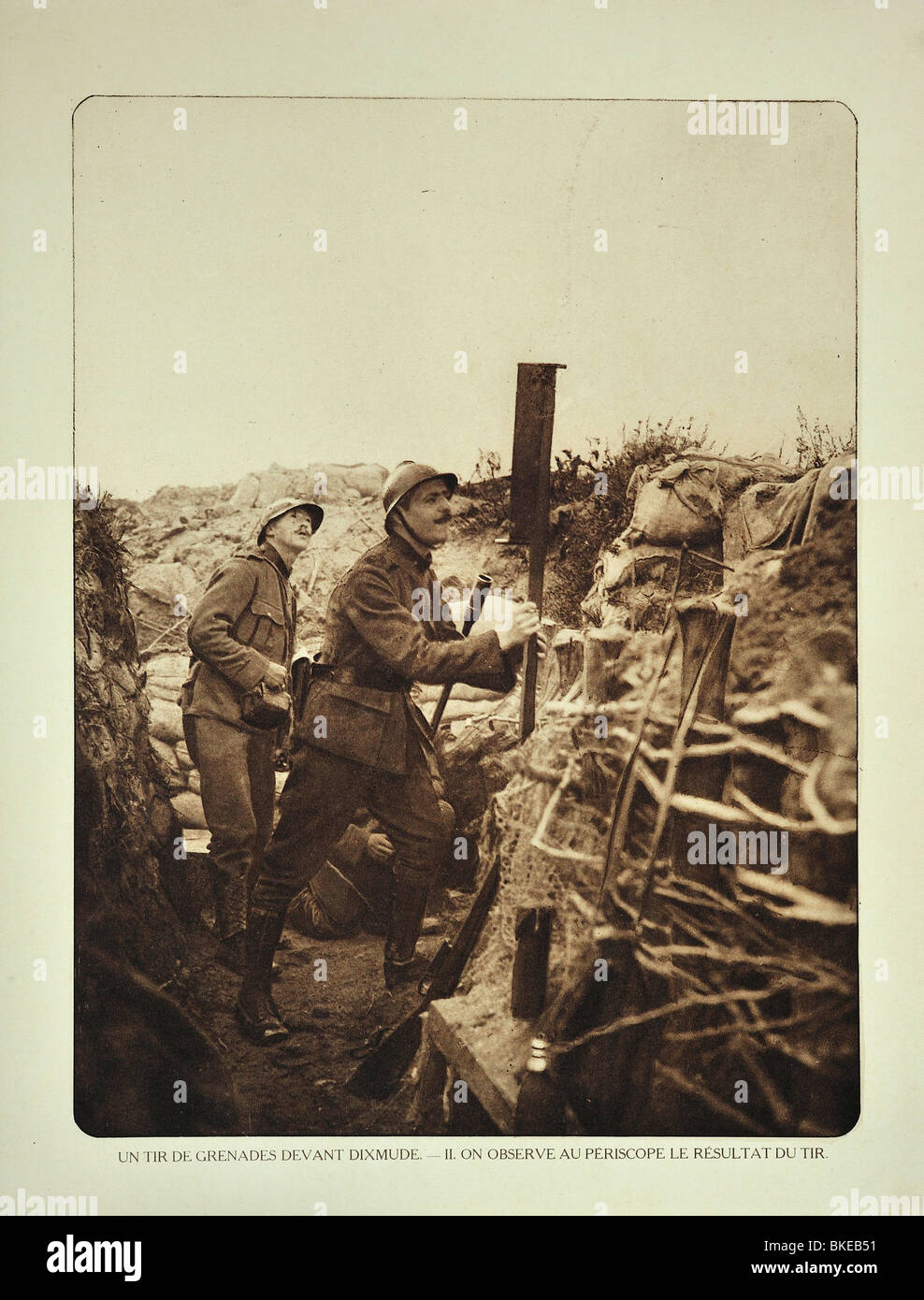 Soldier in trench with periscope checking where grenades strike in battlefield at Diksmuide, West Flanders during WWI, Belgium Stock Photo