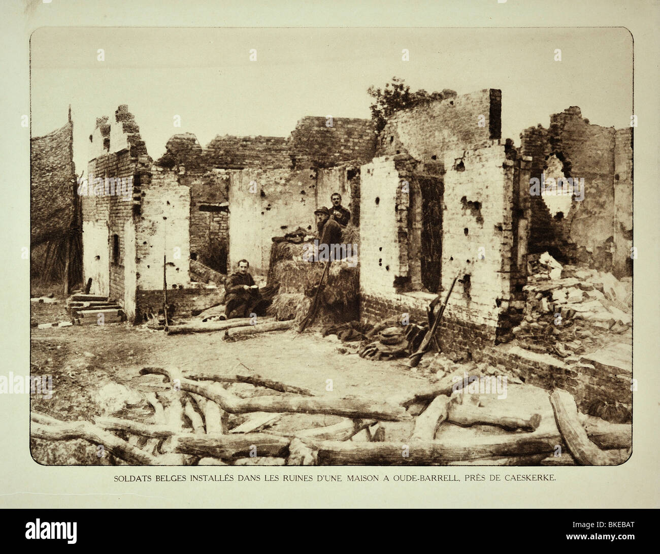 WWI soldiers occupying house in ruins after bombardment at Kaaskerke in West Flanders during the First World War One, Belgium Stock Photo