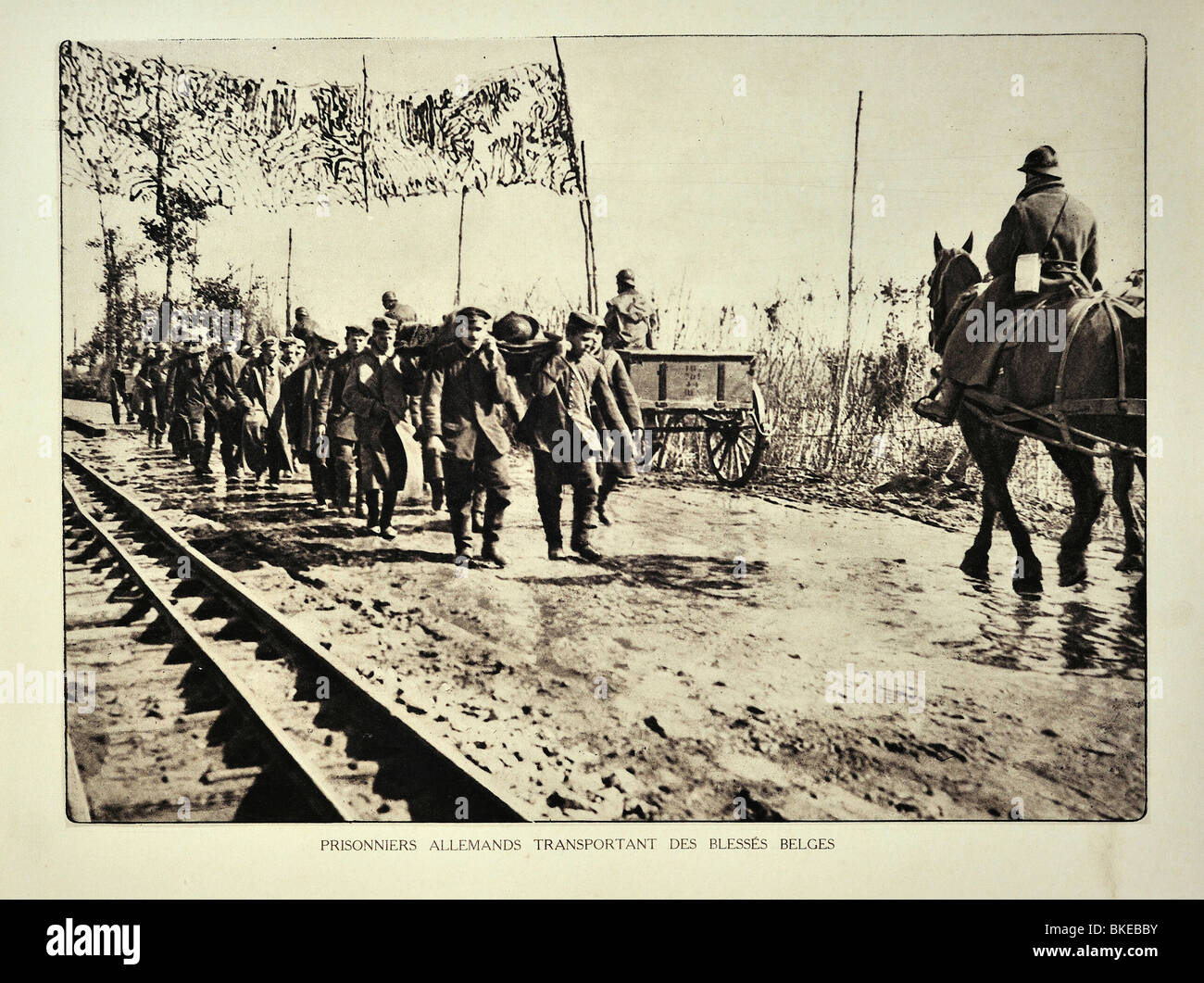 WW1 German prisoners evacuating wounded Belgian soldiers on stretchers in West Flanders during First World War One, Belgium Stock Photo