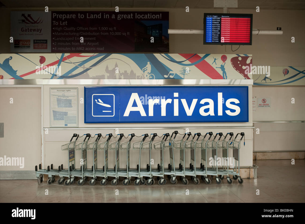 Airport Arrivals with trolleys and all flights cancelled Stock Photo