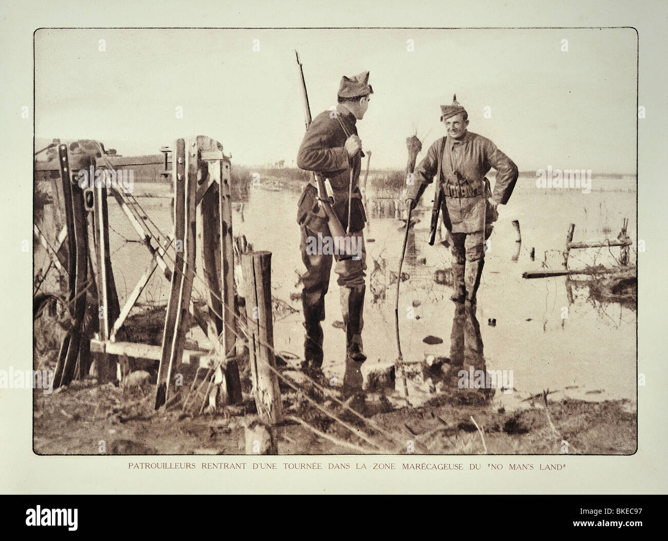 WWI Belgian soldier returning from reconnaissance patrol in flooded terrain in West Flanders during First World War One, Belgium Stock Photo